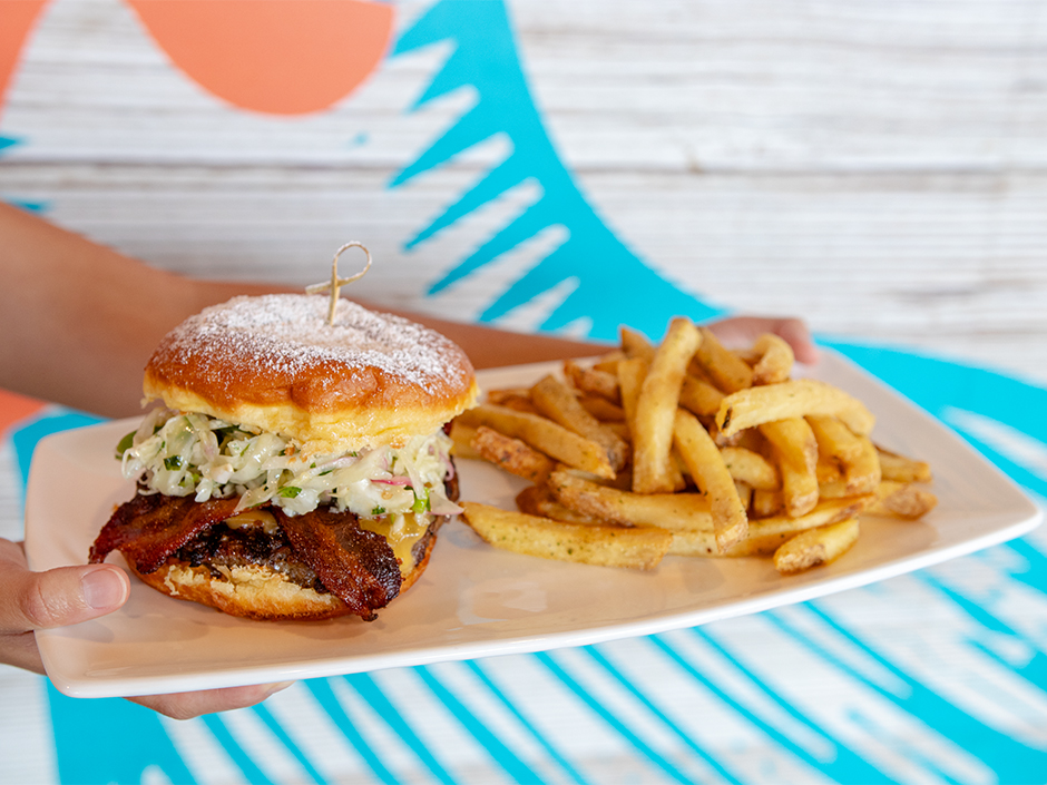Plate of the Bacon-Donut Fusion with a side of French fries, a new dish at The Cowfish Sushi Burger Bar in Universal CityWalk.