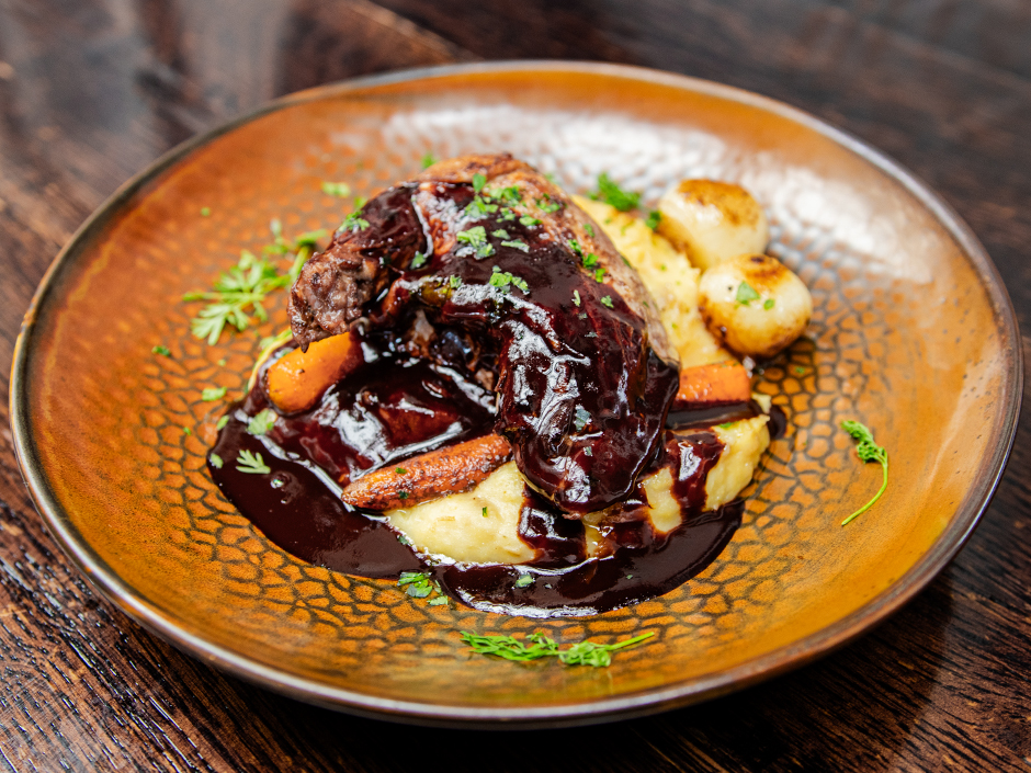 Plate of the Cocoa Coq Au Vin, a new dish at The Toothsome Chocolate Emporium & Savory Feast Kitchen in Universal CityWalk.