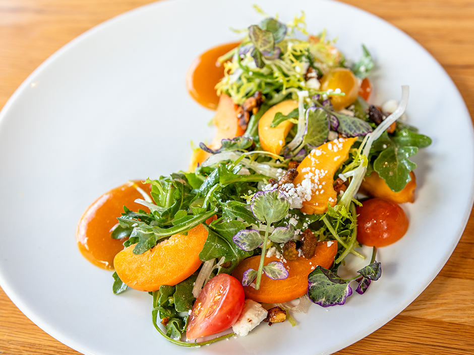 Plate of the Seasonal Stone Fruit Salad, a dish on the new menu at Bigfire in Universal CityWalk.