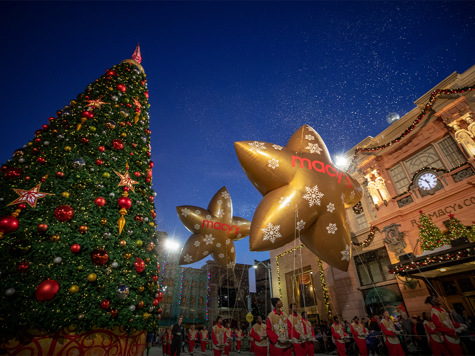 Universal’s Holiday Parade featuring Macy’s passes by the Christmas tree in Universal Studios Florida