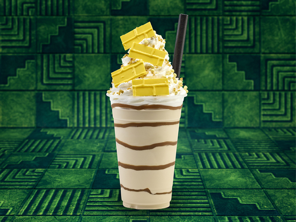 The Yellow Road Shake in front of a green tile background for