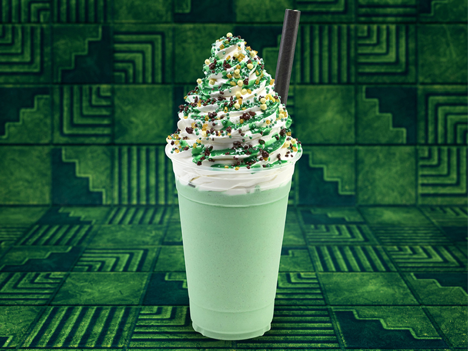 The Wizard Elixir Shake in front of a green tile background for