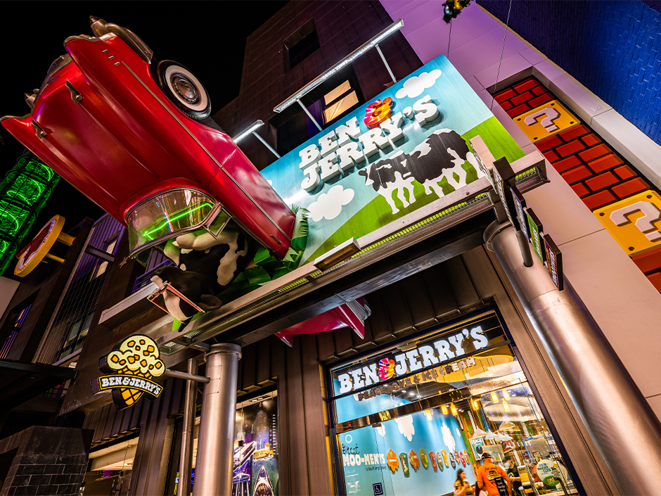 Ben & Jerry's storefront. Car in a sign.