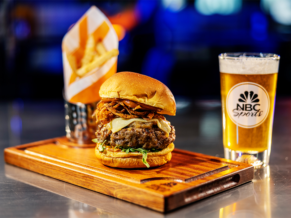 Photo of a beer, burger, and fries.