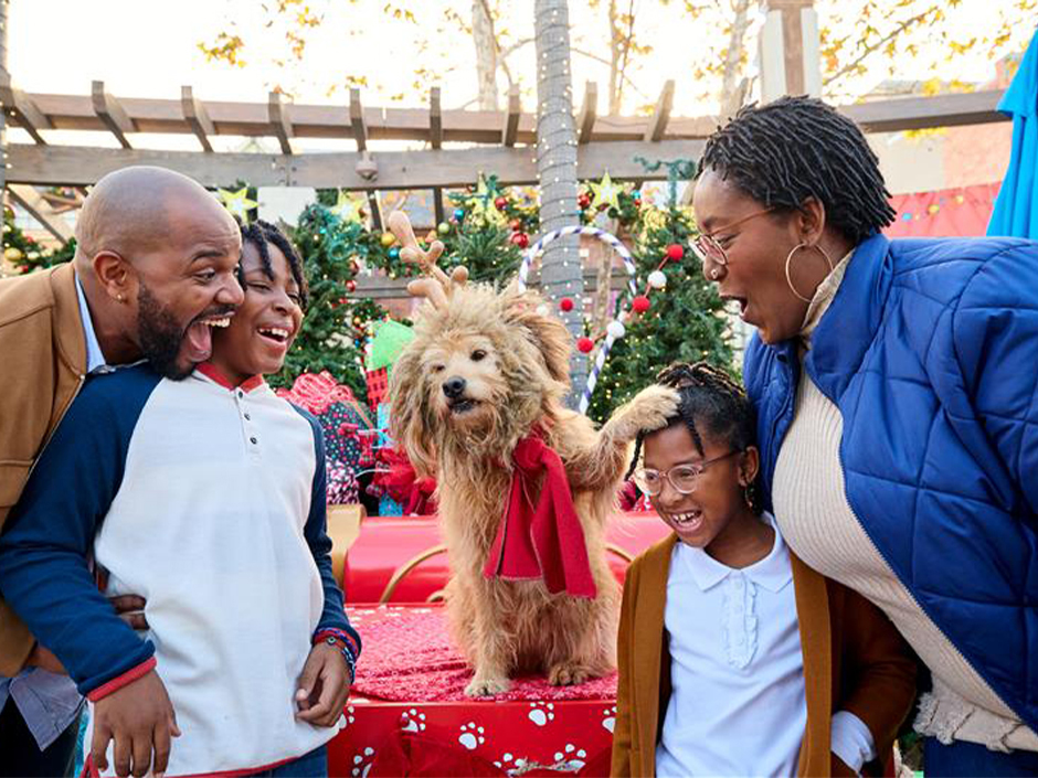 Family meets Max the dog during Grinchmas at Universal Studios Hollywood.