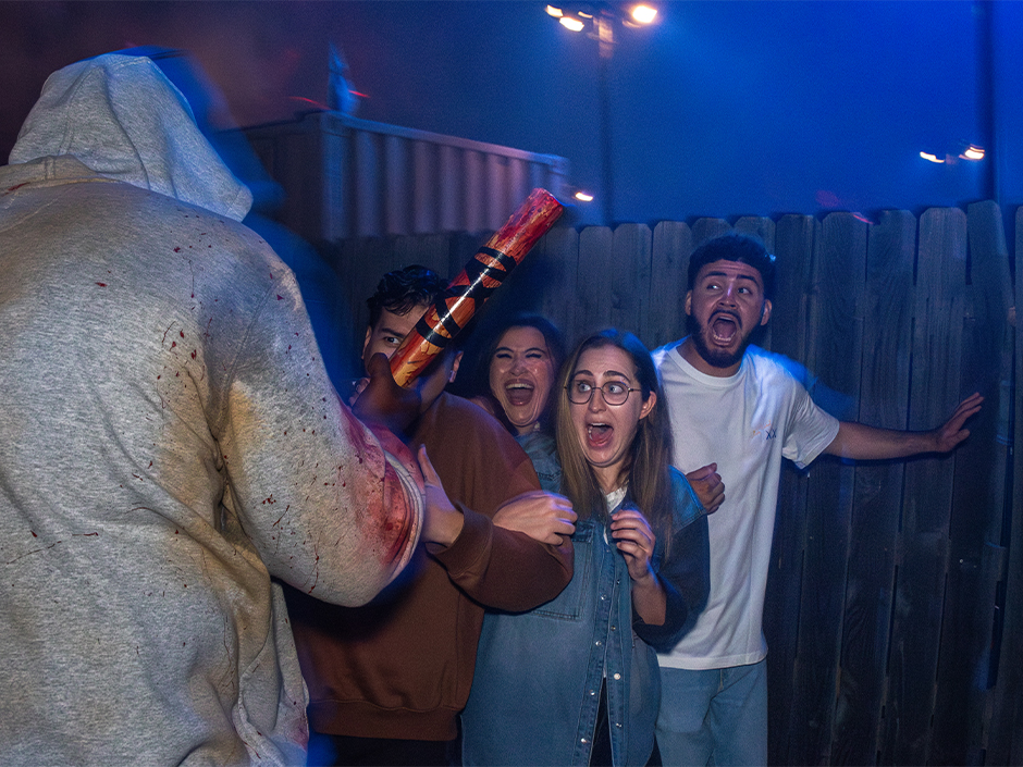 Guests reacting to terrifying character on the Terror Tram at Halloween Horror Nights.