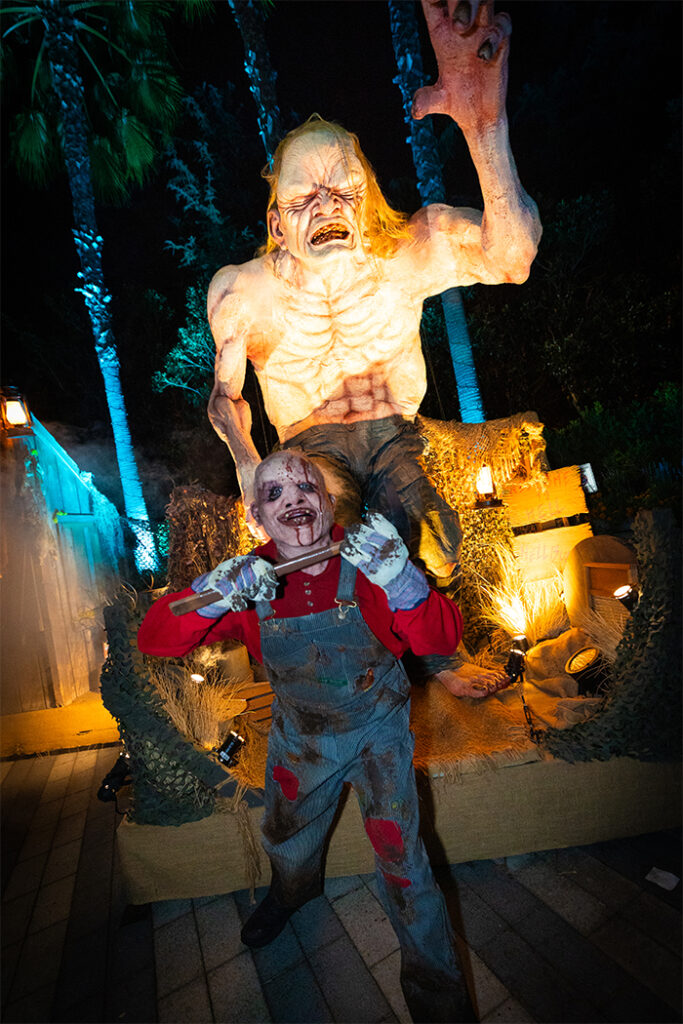Creature frightening guests on the Terror Tram at Halloween Horror Nights.