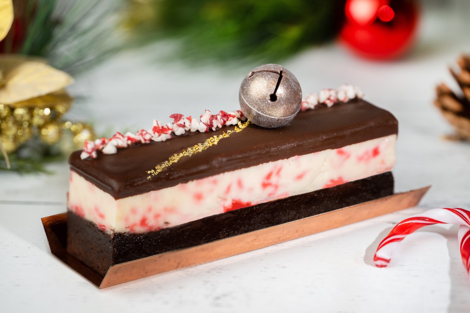 Candy Cane Cheesecake Brownie: Peppermint cheesecake, decadent brownie, and dark chocolate ‘sleigh bell’ truffle 