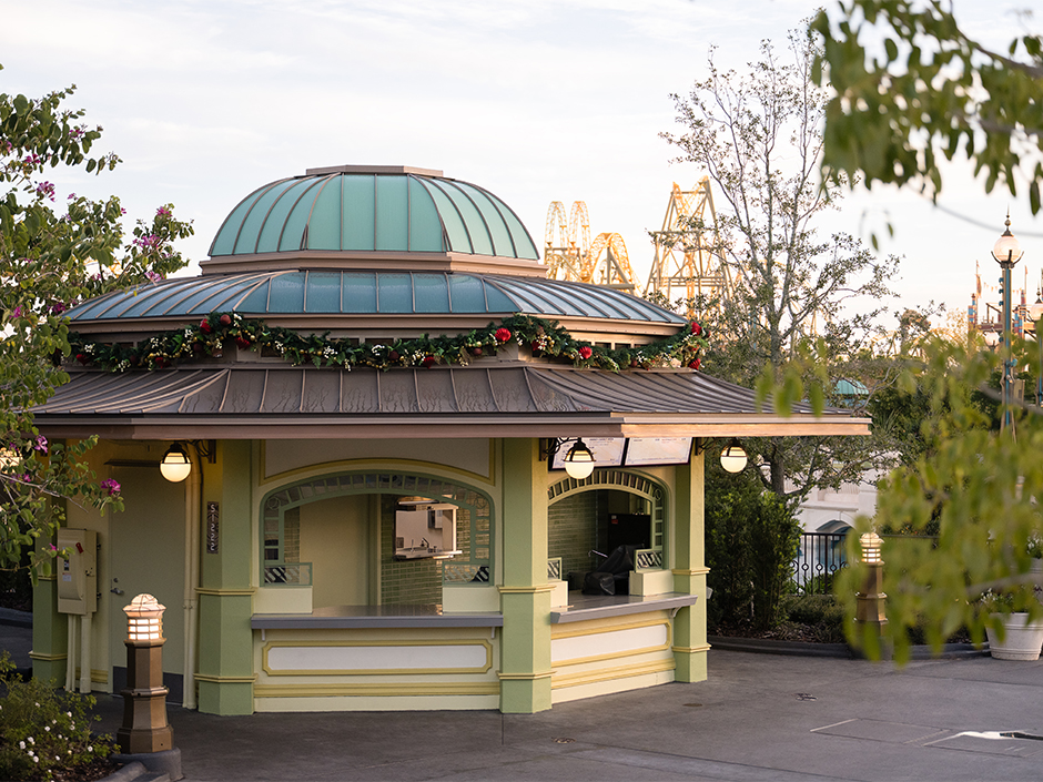 Garland and decor on a Guest Services kiosk in Celestial Park