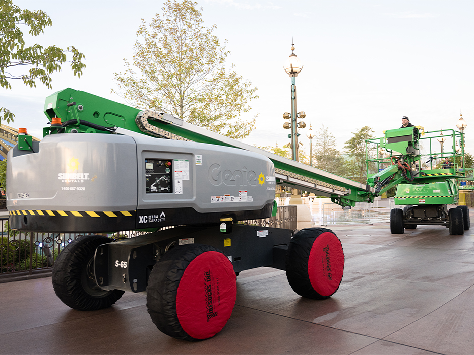Two construction vehicles used in the holiday decorating of Celestial Park