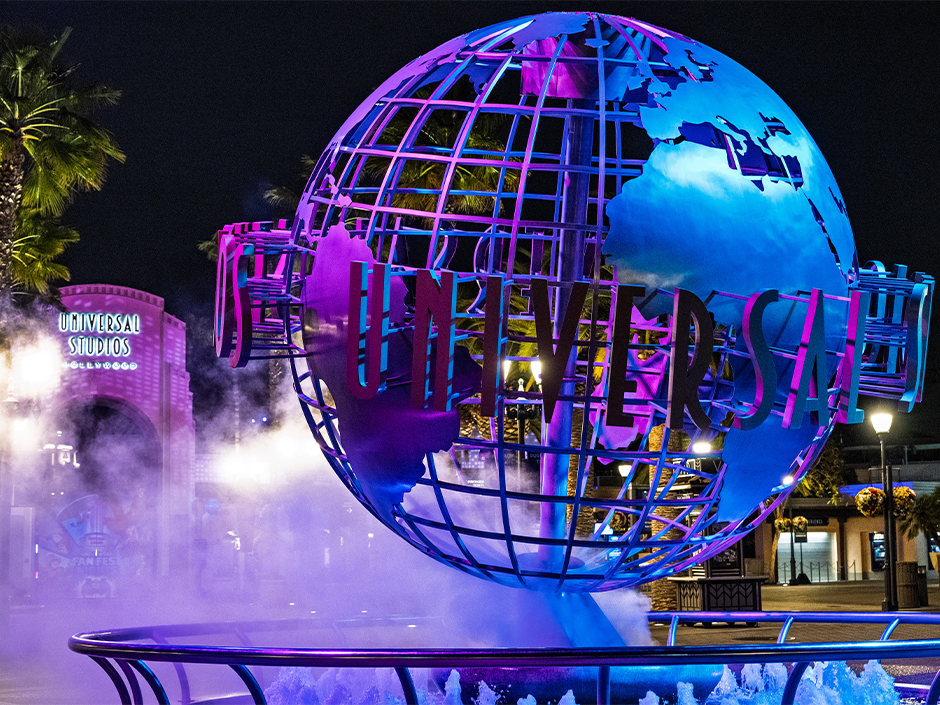 Universal Studios Hollywood globe lit blue and purple for Fan Fest Nights.