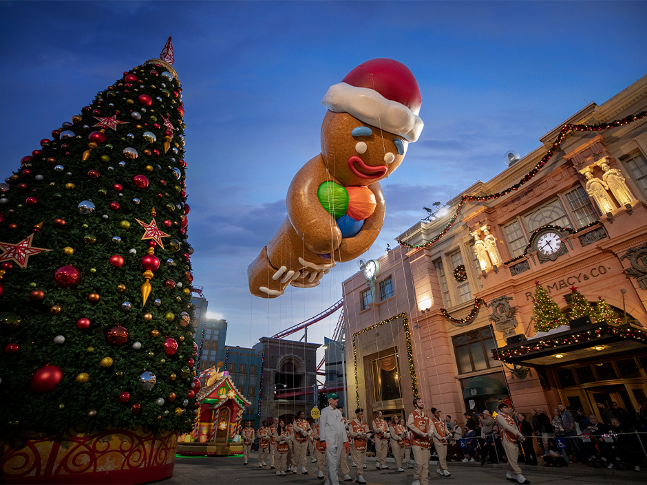The Gingy balloon floats above the crowd in the Universal Holiday Parade featuring Macy's
