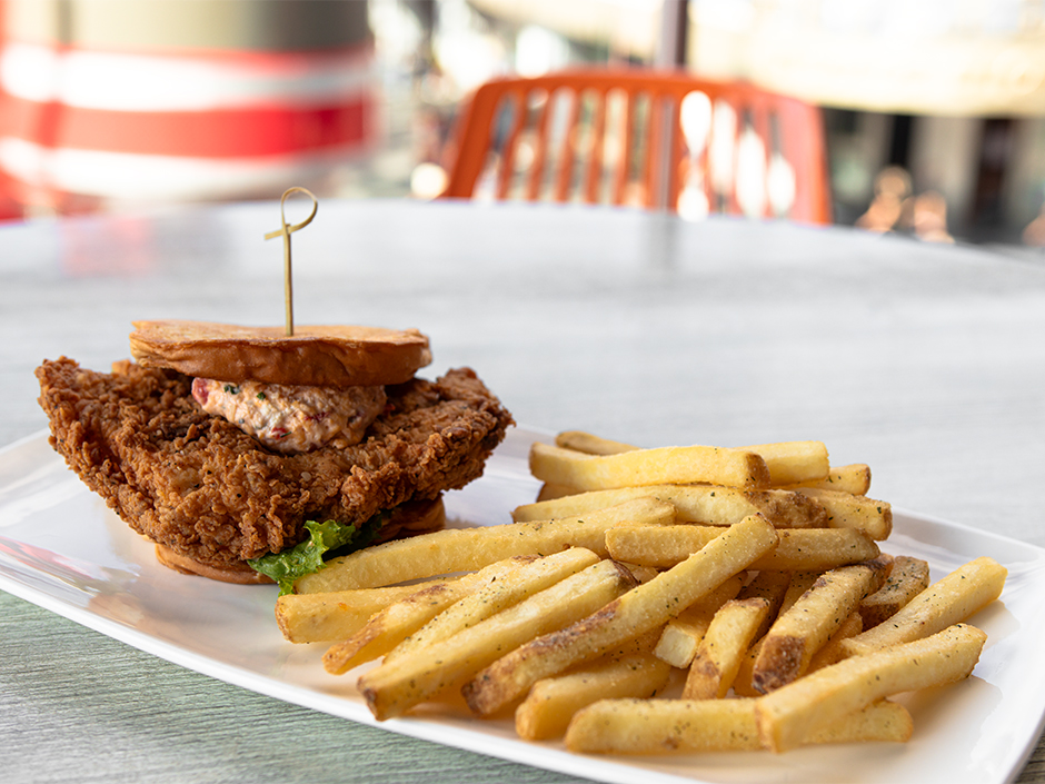 A plate of the Parris Island Pork Chop Sandwich and fries at Cowfish in Universal CityWalk for Veterans and Military Families Appreciation Month.